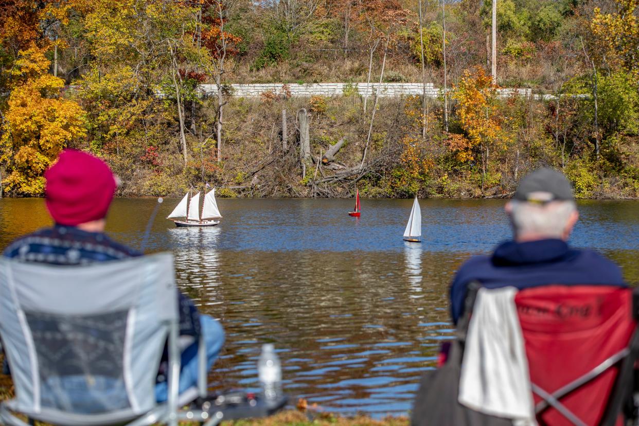 John Schall, left, and George Jewell, members of the Michiana R/C Yacht Club, enjoy a sunny day at Pinhook Lagoon in South Bend.