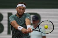Norway's Casper Ruud backhands to Croatia's Marin Cilic during their semifinal of the French Open tennis tournament at the Roland Garros stadium Friday, June 3, 2022 in Paris. (AP Photo/Michel Euler)