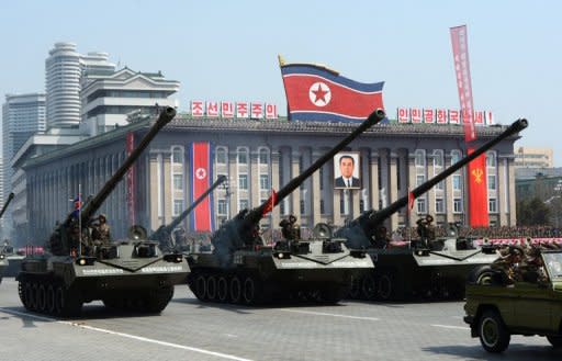 North Korean artillery units are displayed during a military parade in Pyongyang in April 2012. North Korea's new constitution proclaims its status as a nuclear-armed nation, complicating international efforts to persuade Pyongyang to abandon atomic weapons, analysts said Thursday