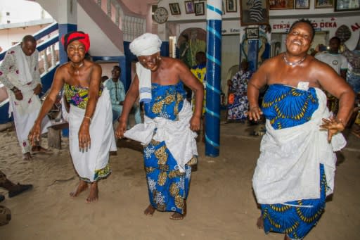 Women dance at a shrine in Cotonou during a voodoo fetish ceremony to wish Benin's team luck in the Africa Cup of Nations