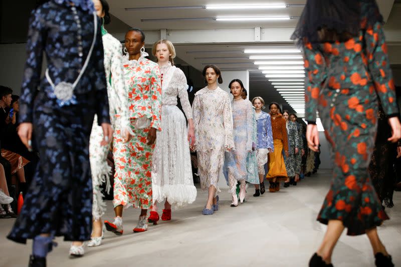 Models present creations during the Yuhan Wang catwalk show at London Fashion Week in London