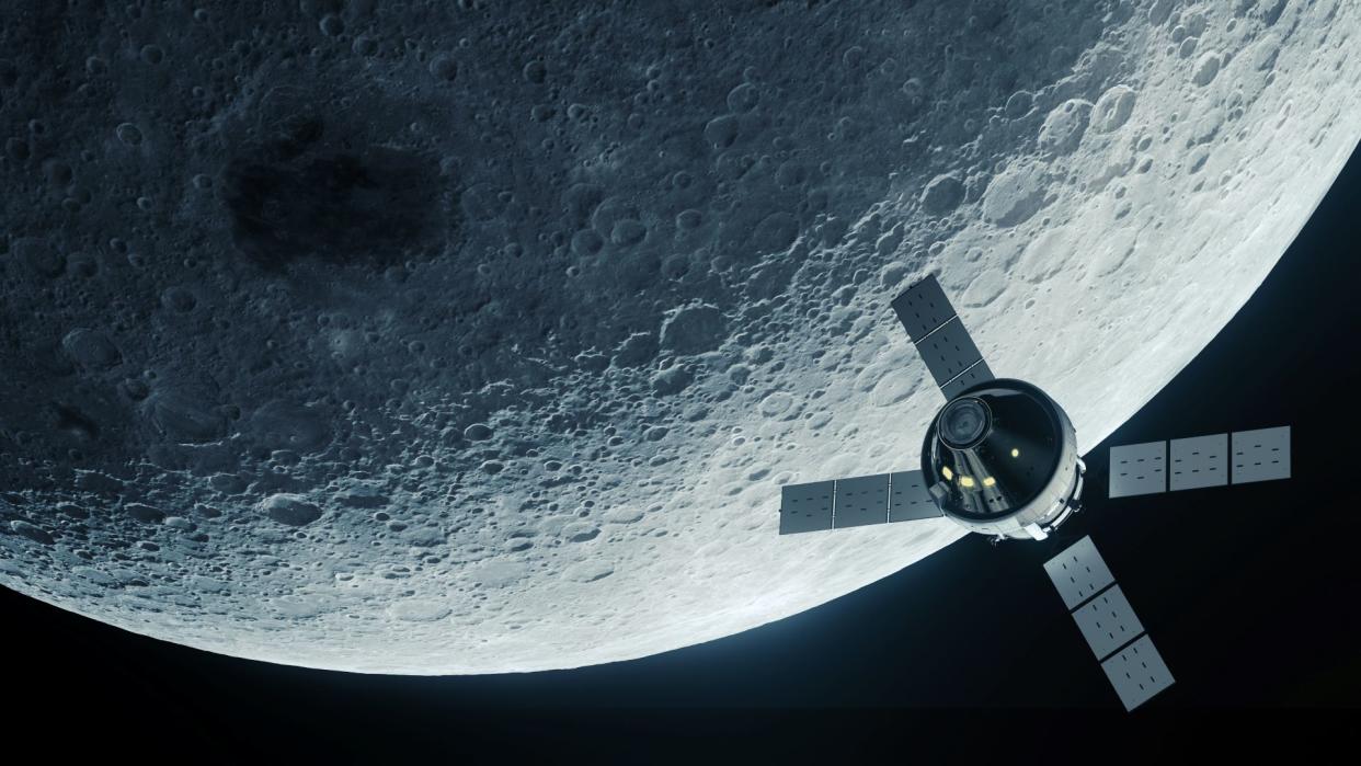  Illustration of the orion spacecraft above the moon. 