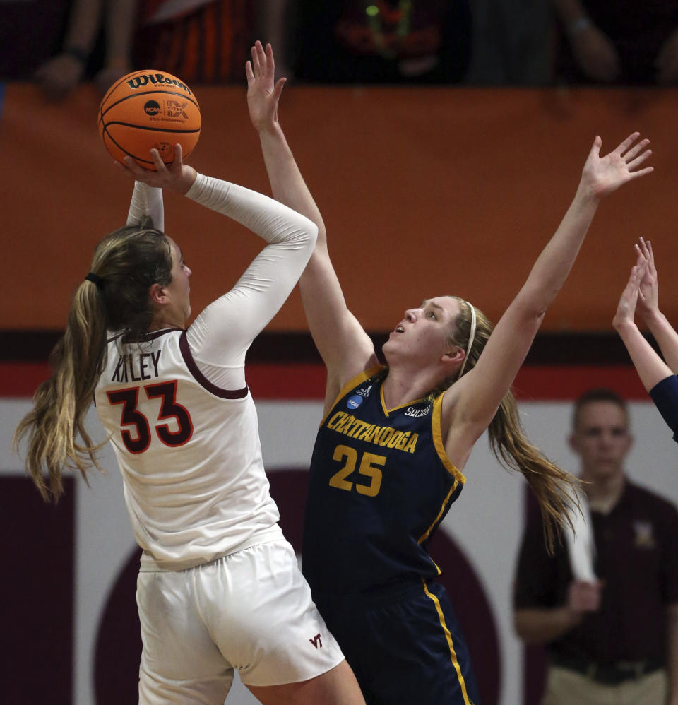 Virginia Tech's Elizabeth Kitley (33) shoots and scores over Chattanooga's Abbey Cornelius (25) during the second quarter of a first-round college basketball game in the women's NCAA Tournament, Friday, March 17, 2023, in Blacksburg, Va. (Matt Gentry/The Roanoke Times via AP)