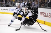 San Jose Sharks center Tommy Wingels, left, pushes down Los Angeles Kings center Anze Kopitar, of Slovenia, during the third period in Game 6 of an NHL hockey first-round playoff series, Monday, April 28, 2014, in Los Angeles. The Kings won 4-1. (AP Photo)