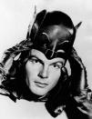 <p>Adam West puts on the mask of the comics superhero Batman in the TV series “Batman,” 1966. (Photo: Mondadori Portfolio by Getty Images) </p>