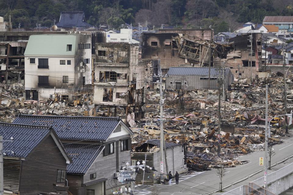The aftermath of a fire at a shopping area is seen in Wajima in the Noto peninsula, facing the Sea of Japan, northwest of Tokyo, Friday, Jan. 5, 2024, following Monday's deadly earthquake. (AP Photo/Hiro Komae)