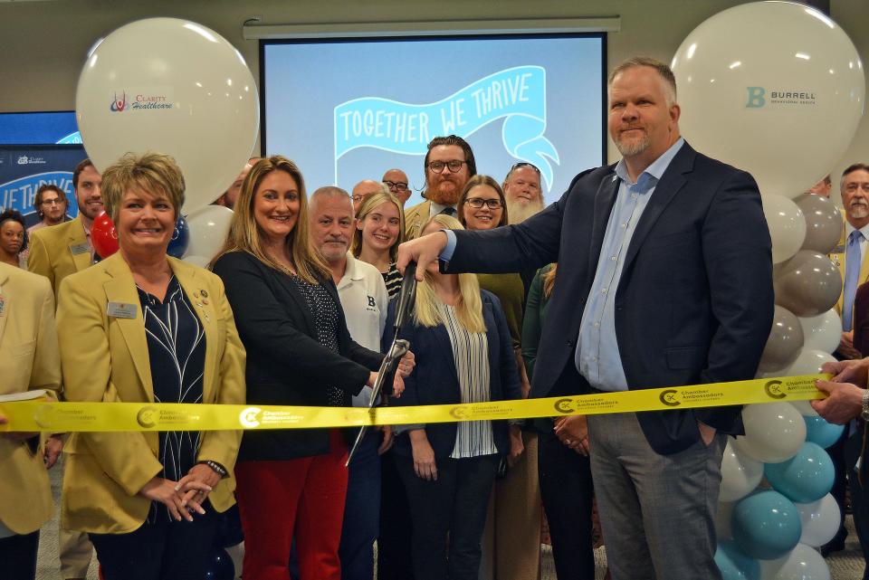 Megan Steen, Brightli regional chief operations officer, second from left, and Mat Gass, Brightli central region president, prepare to cut the ribbon on the inaugural provider fair for Burrell Behavioral Health and Clarity Health Care.