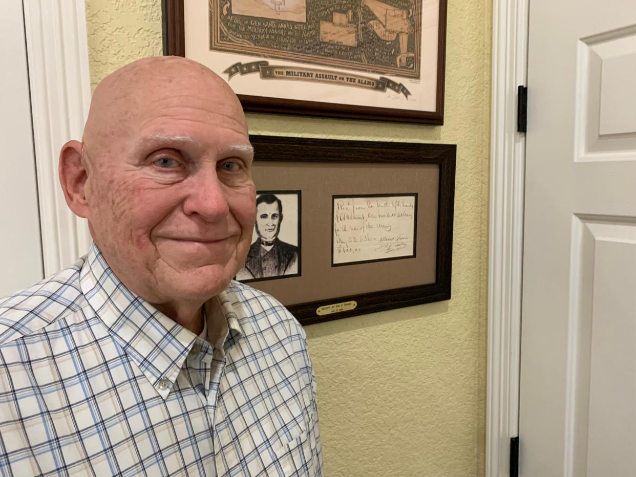 Texas history buff Jerry Stephens of Georgetown with a framed, hand-written receipt for $100 signed by William B. Travis that was sold to him by famed Austin antiques dealer Charles “Lucky” Attal. Stephens wants Texas and Mexico to exchange captured battle flags as an act friendship.