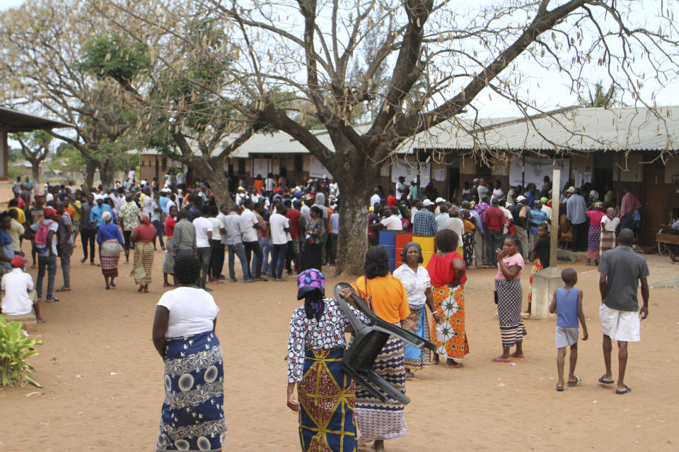 Voters queue to cast their votes in Maputo, Mozambique, Tuesday, Oct. 15, 2019 in the country's presidential, parliamentary and provincial elections. Polling stations opened across the country with 13 million voters registered to cast ballots in elections seen as key to consolidating peace in the southern African nation. (AP Photo/Ferhat Momade)