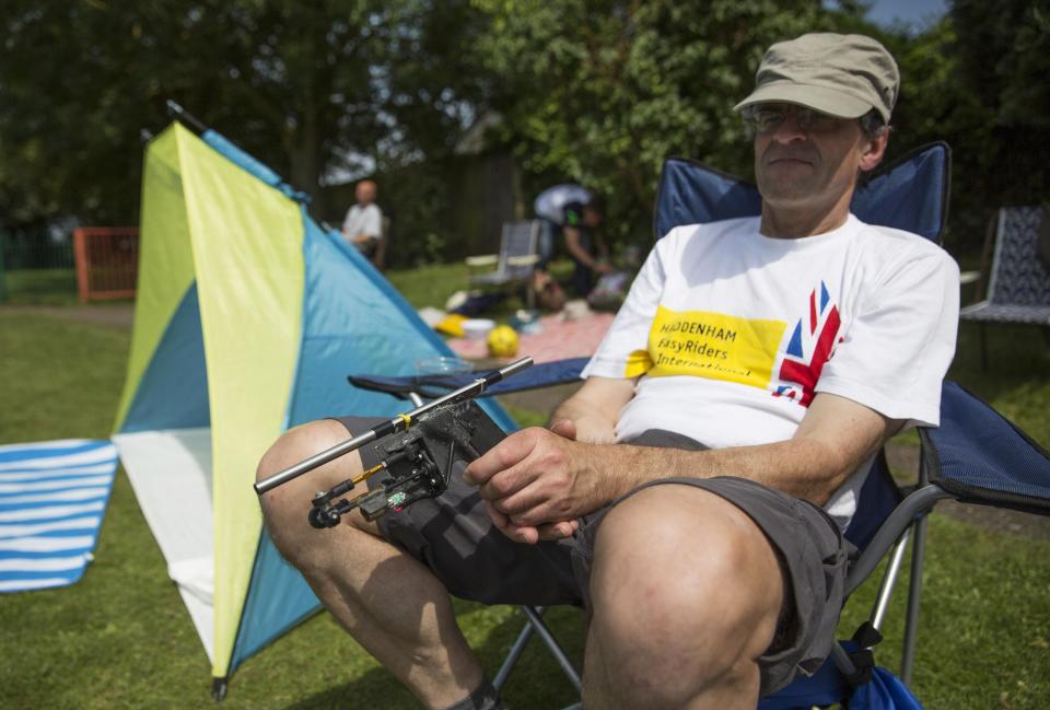 A competitor waits for his turn with his customised pea shooter during the 2014 World Pea Shooting Championship in Witcham, southern England