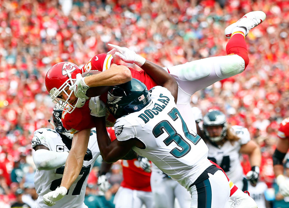 <p>Tight end Travis Kelce #87 of the Kansas City Chiefs leaps over defenders into the end zone for a touchdown during the 2nd half of the game against the Philadelphia Eagles at Arrowhead Stadium on September 17, 2017 in Kansas City, Missouri. (Photo by Jamie Squire/Getty Images) </p>