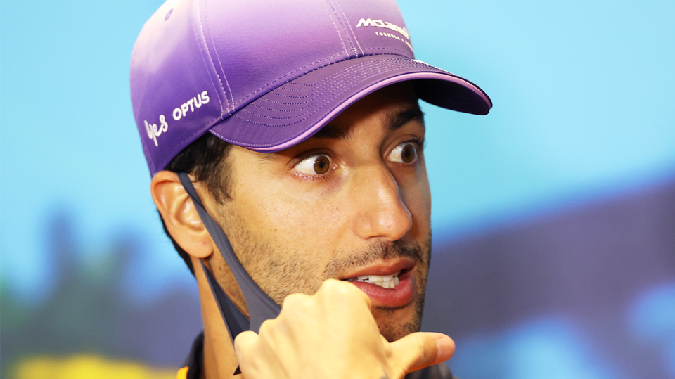 F1 McLaren driver Daniel Ricciardo (pictured) reacts during a press conference.