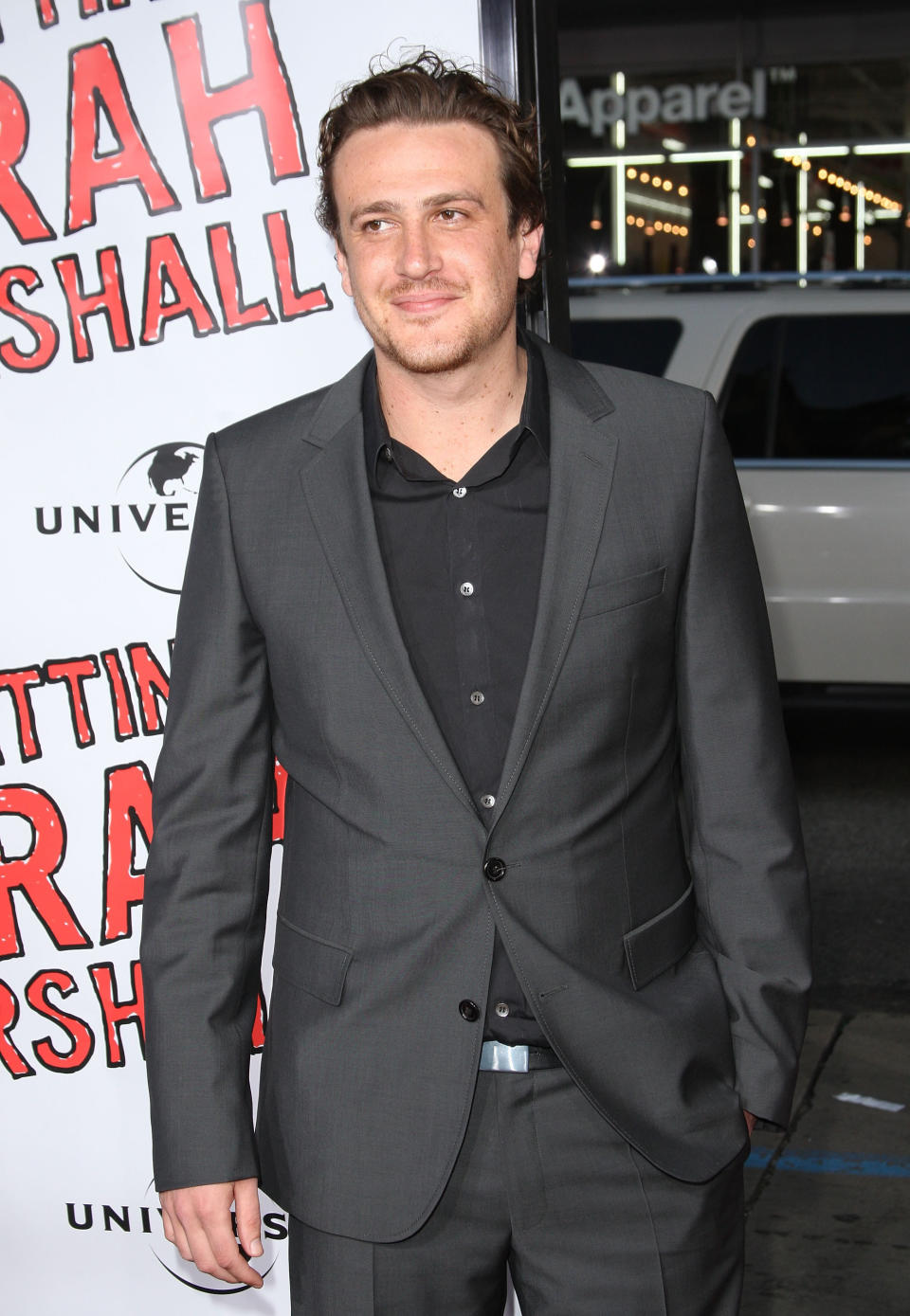 Jason Segal standing on the red carpet with a closed-mouth grin at the premiere of "Forgetting Sarah Marshall"