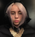 <p>Billie Eilish? In pink?! I never thought I'd see it. Keeping the whole vibe 100% unique, she complimented her rosey locks with a gold chain and matching gold leaf freckles. </p>