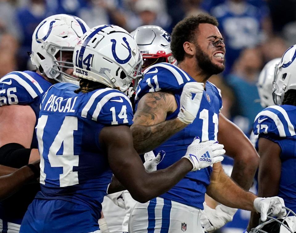 Indianapolis Colts wide receiver Michael Pittman Jr. (11) reacts as he gets up after fighting with New England Patriots safety Kyle Dugger (23) on Saturday, Dec. 18, 2021, during a game against the New England Patriots at Lucas Oil Stadium in Indianapolis.