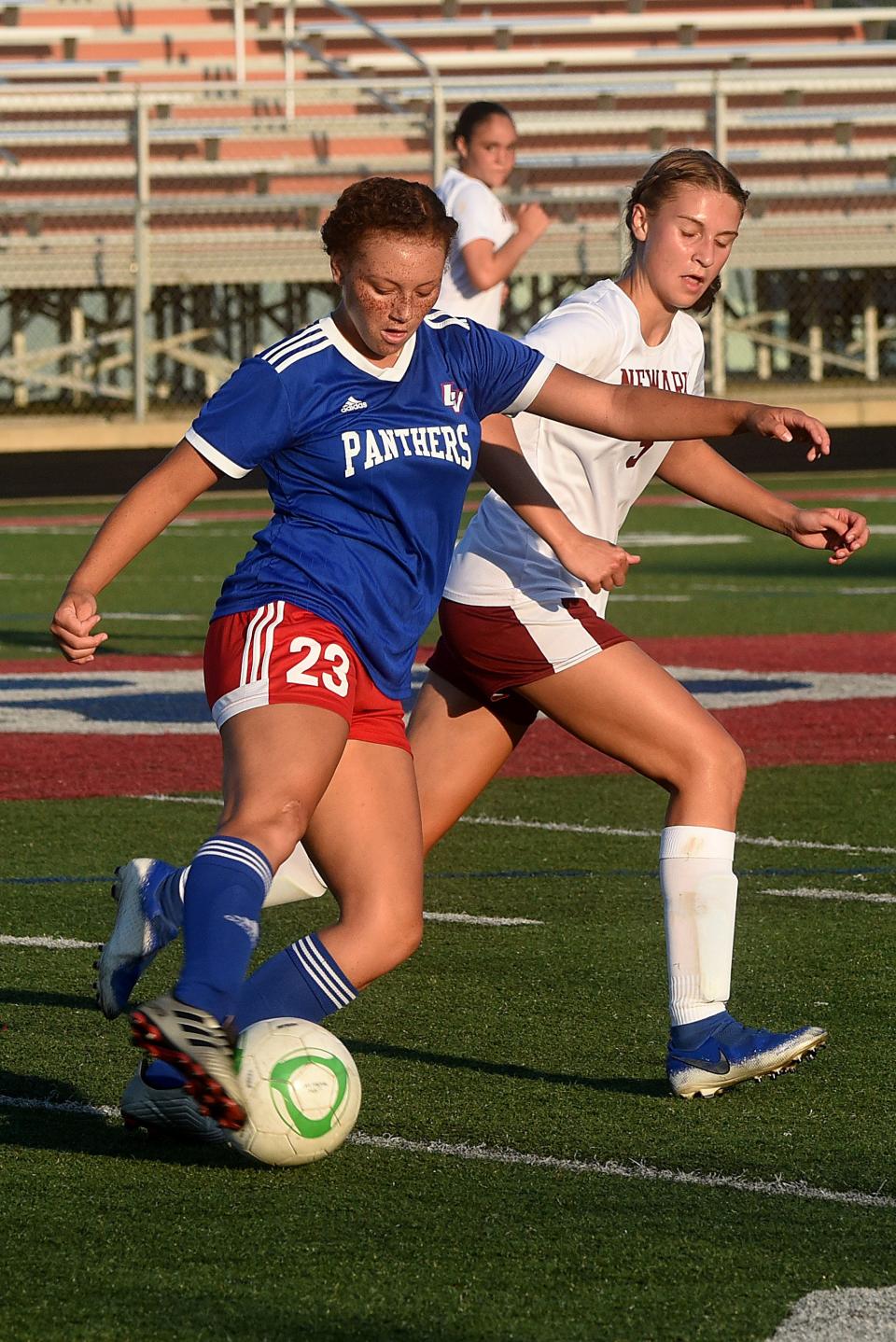 Licking Valley's Kylee White tries to keep the ball away from Newark's Nadia Liesen during a preseason scrimmage Aug. 3, 2021, at Valley. The Wildcats won 3-1.