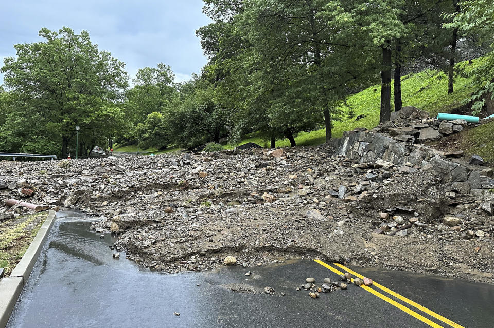 Mud, rocks and debris from Sunday's flash flood cover a road on the campus of the United States Military Academy at West Point, Monday, July 10, 2023 in West Point, N.Y. Heavy rain has washed out roads and forced evacuations in the Northeast as more downpours were forecast throughout the day, Monday. (Courtesy of the USMA via AP)