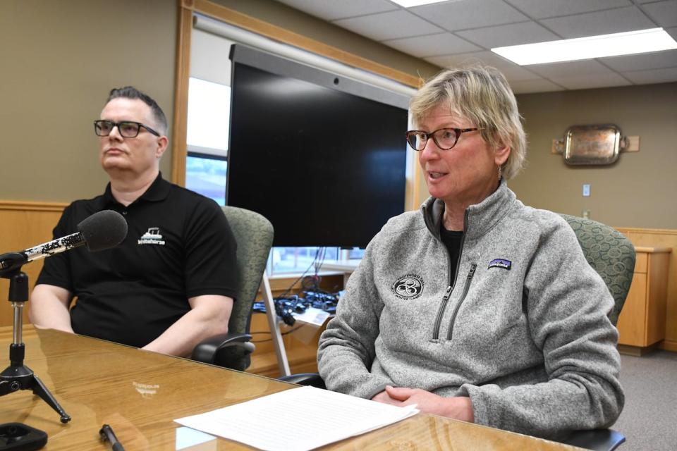 Whitehorse mayor Laura Cabott, right, speaks at a press conference on March 12 about the release of the city's study on free transit as transit services manager Jason Bradshaw looks on.