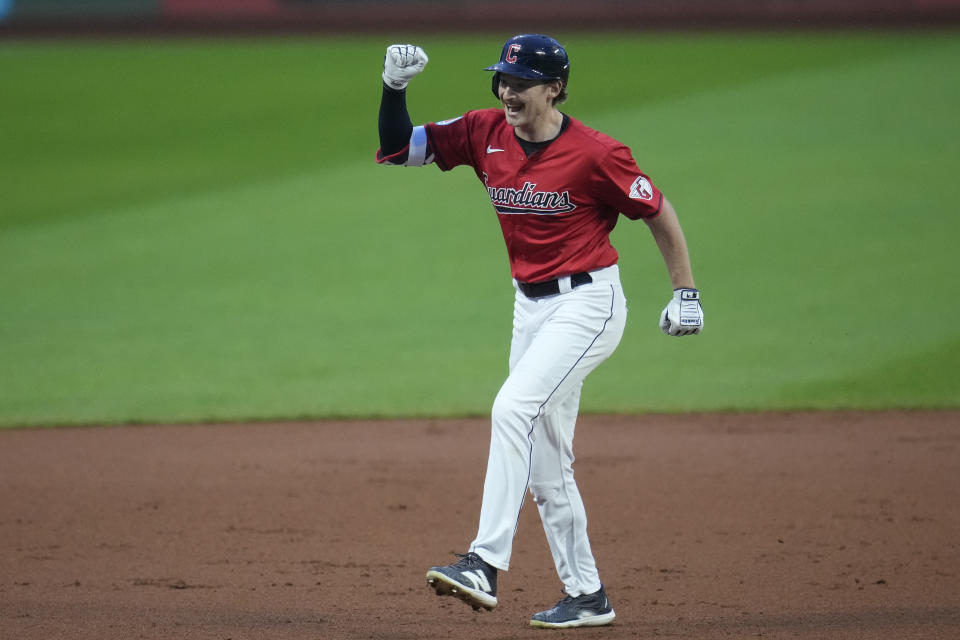 Cleveland Guardians' Kyle Manzardo celebrates as he runs the bases with a home run in the first inning of a baseball game against the Cincinnati Reds in Cleveland, Tuesday, Sept. 24, 2024. (AP Photo/Sue Ogrocki)