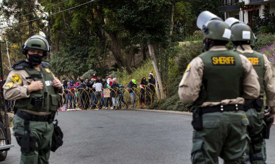 Family members of victims protest outside sheriff's home in La Habra, CA. (Gina Ferazzi / Los Angeles Times via Getty Images)