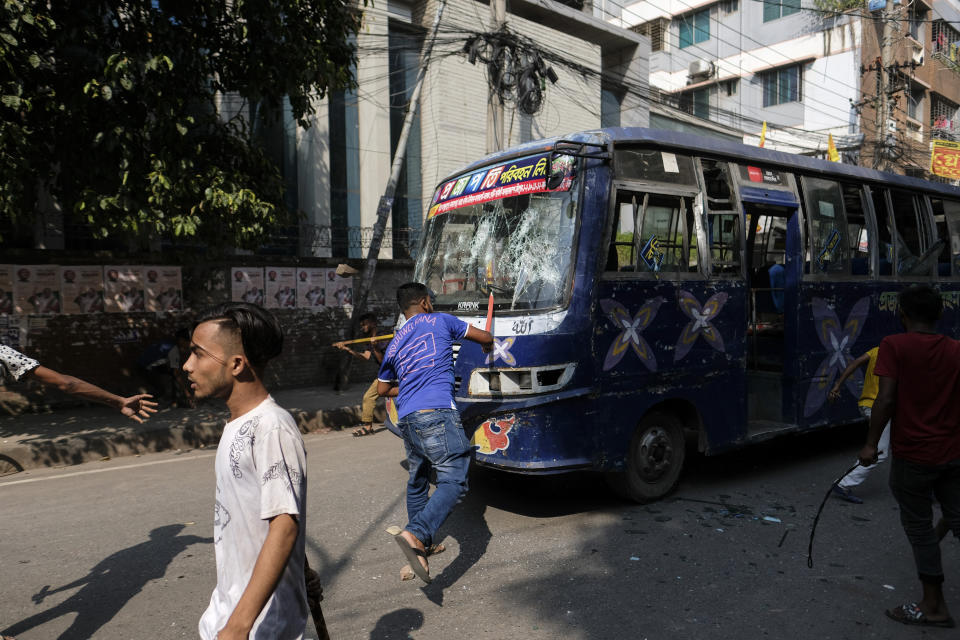 Bangladeshi garment workers vandalize buses during a protest demanding an increase in their wages at Mirpur in Dhaka, Bangladesh, Tuesday, Oct.31, 2023. (AP Photo/Mahmud Hossain Opu)