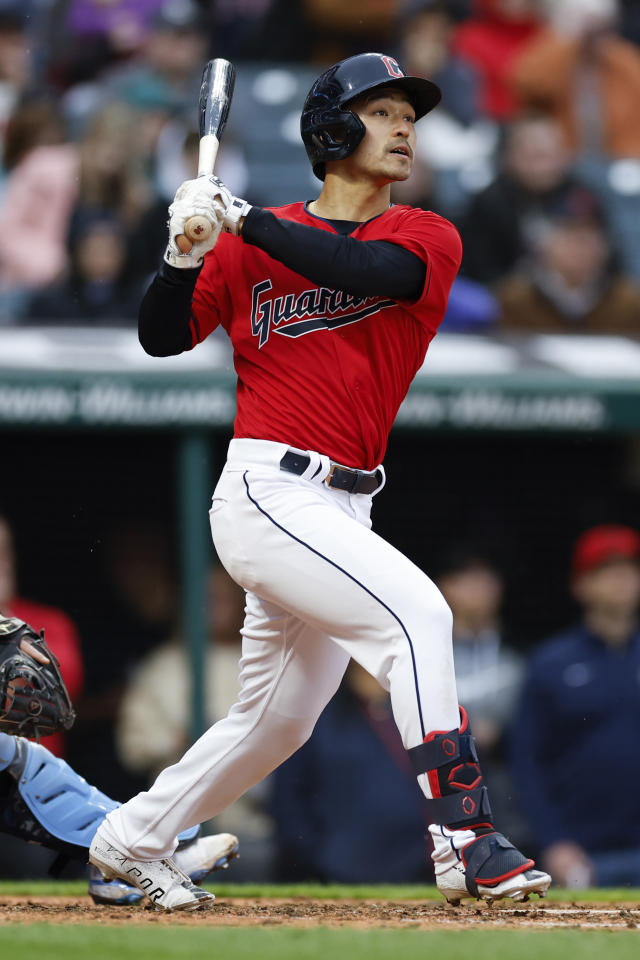 Cleveland Guardians' Steven Kwan watches his two-run triple during