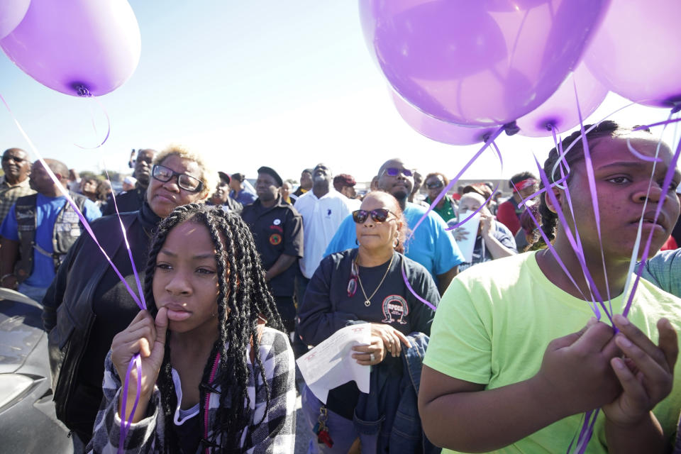 Zyriah Taylor, 11, left, and her cousin, Jaskya Lee-Mills, 13, attend a community rally for seven-year-old Jazmine Barnes on Saturday, Jan. 5, 2019 in Houston. Barnes was killed when a driver shot into the car she and her family were driving in last Sunday. (Melissa Phillip/Houston Chronicle via AP)