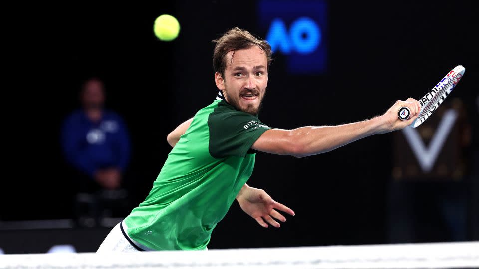 Daniil Medvedev hits a return during the men's singles final at the Australian Open. - David Gray/AFP/Getty Images