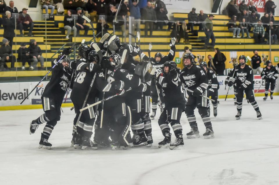 The Providence Friars celebrate their 1-0 Hockey East semifinal win over the UVM Catamounts on Wednesday evening at Gutterson Fieldhouse.