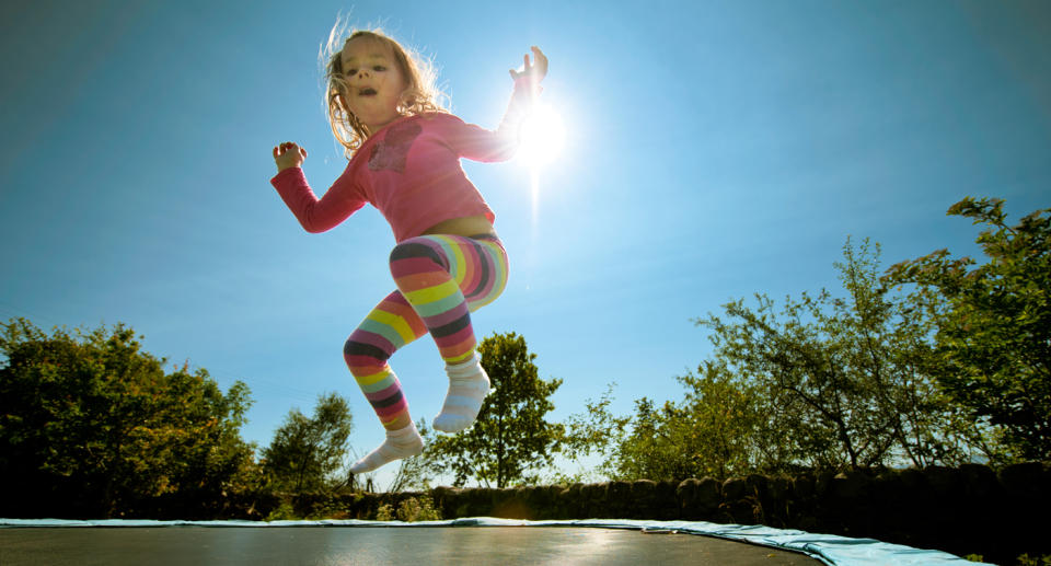 a child on a trampoline 