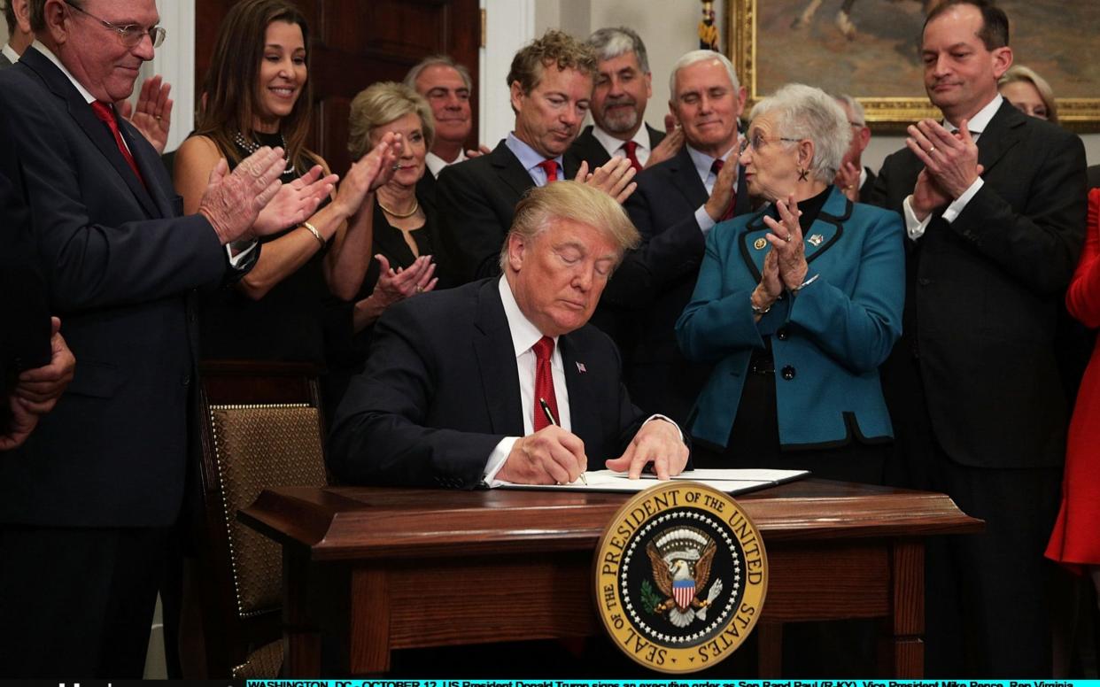 Donald Trump signs an executive order on healthcare - Getty Images North America