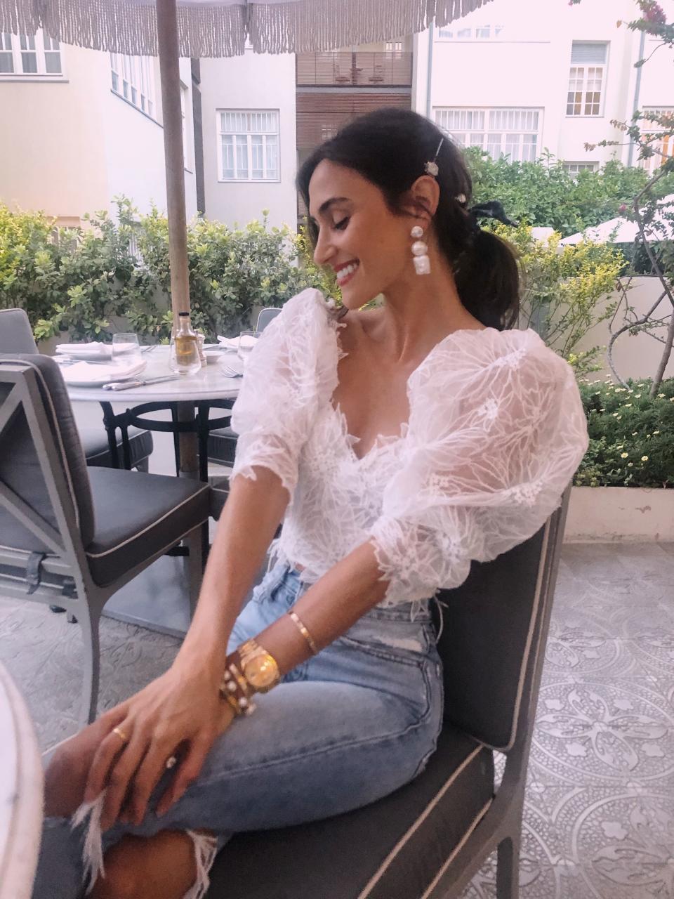 Wearing Israeli designer Dana Harel—she custom made me this top as a wedding gift. Earrings are from the Dannijo bridal collection I designed to wear during my wedding weekend.