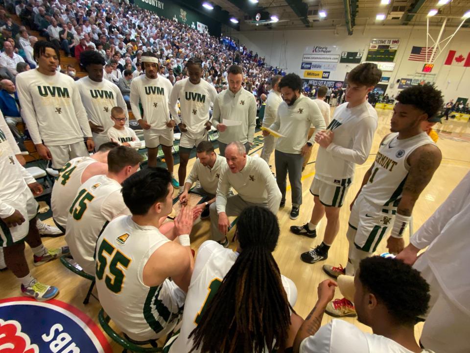 Vermont coach John Becker talks it over with the Catamounts during the first media timeout of the America East championship on March 11, 2023 from Patrick Gym.