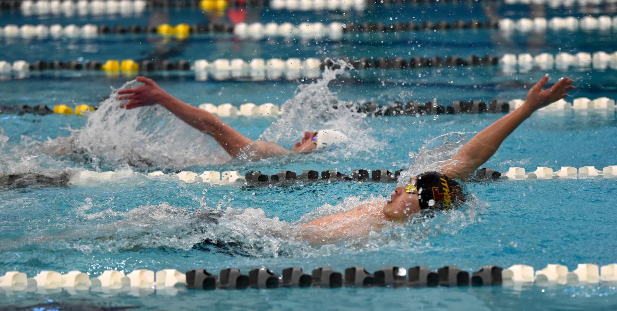 Ithaca's Spencer Hwang-Geddes, front, won the 100-yard backstroke at the Section 4 Class A boys swimming and diving championship meet Feb. 17, 2024 at Watkins Glen High School.