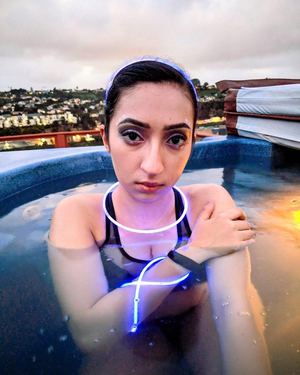 The young woman, posing in a hot tub, now wants to raise awareness about young people suffering from strokes.