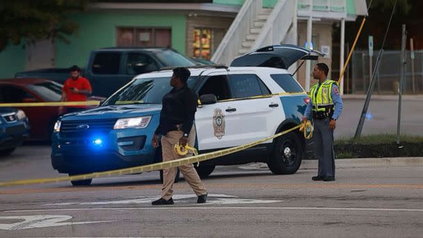 PHOTO: Law enforcement officers block off Old Milburnie Road during a shooting in Raleigh, N.C., Oct. 13, 2022.  (Ethan Hyman/The News & Observer via AP)