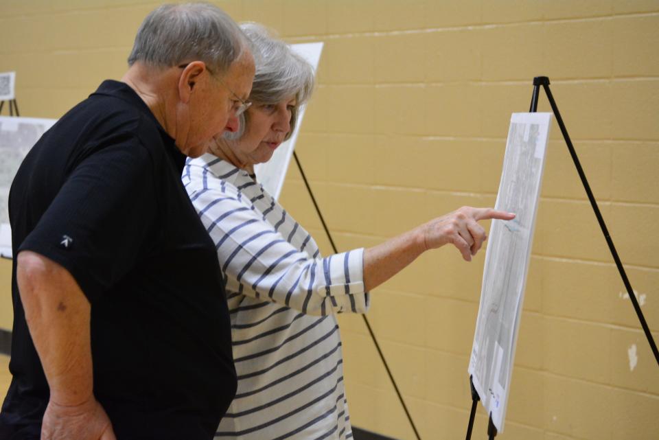 Dave and Nancy Griggs review plans for updating the east side of the U.S. Highway 63 and Grindstone Parkway interchange Thursday at New Haven Elementary School.