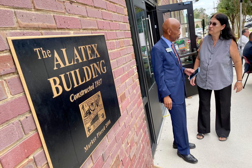 Johnnie Early II, dean of FAMU’s College of Pharmacy and Pharmaceutical Sciences, talks with Ann Spann, chair of the Crestview Historic Preservation Board, during a ceremony Wednesday to mark the 10th anniversary of the FAMU Durell Peaden Jr. Rural Pharmacy Education Campus in Crestview.