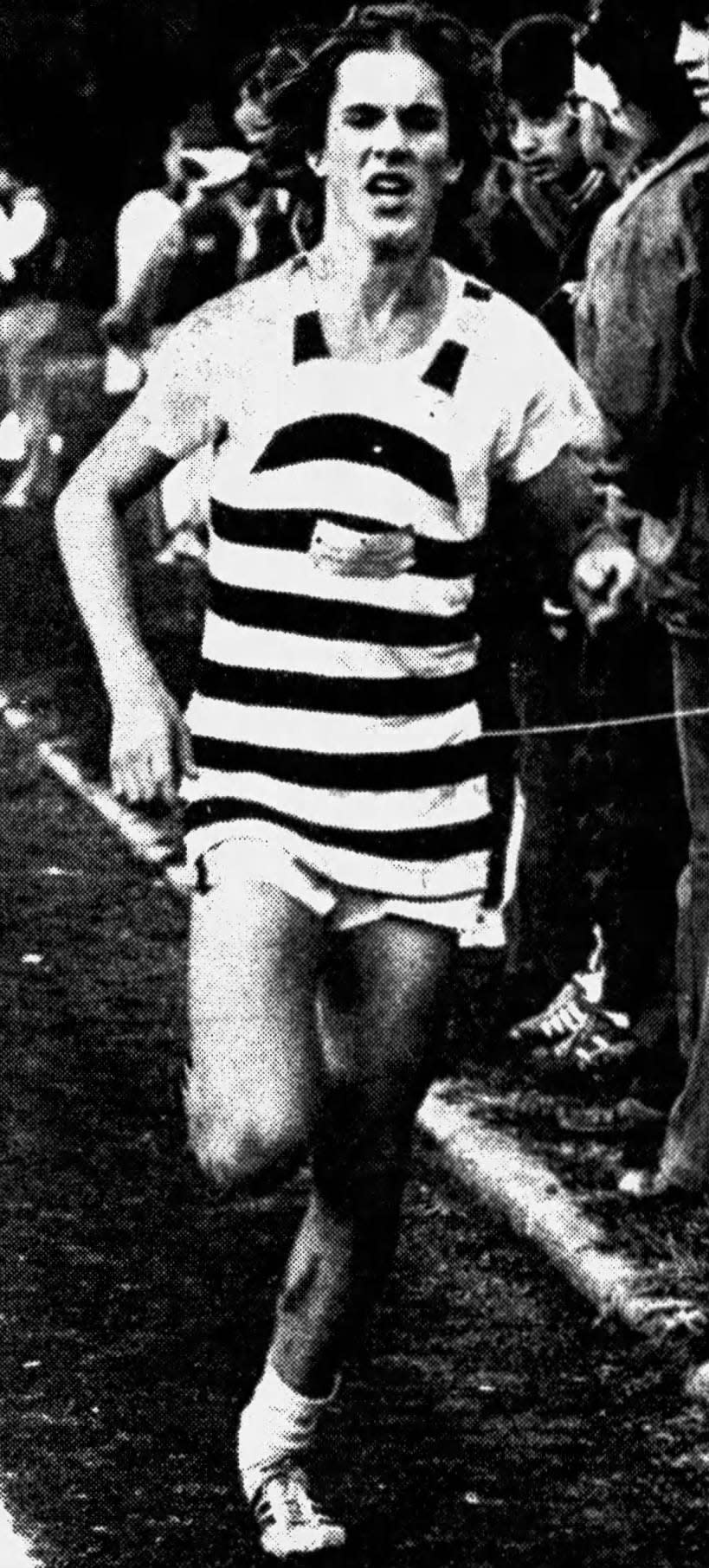 Scott Buttinghausen of New Providence High crosses the finish line as he wins the individual championship in the Union County Cross-Country Meet.