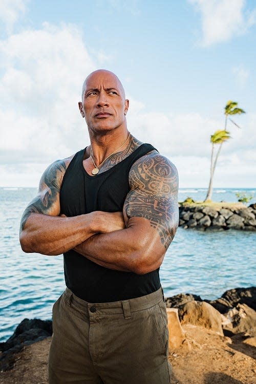 Showing off his guns in the tropical sun: Dwayne "The Rock" Johnson.