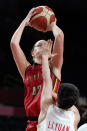 Belgium's Jana Raman (42) shoots over China's Yuan Li during a women's basketball preliminary round game at the 2020 Summer Olympics, Monday, Aug. 2, 2021, in Saitama, Japan. (AP Photo/Charlie Neibergall)