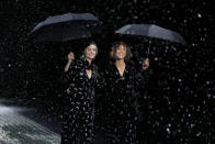 Models wear creations as part of the Emporio Armani women's Fall-Winter 2024-25 collection presented in Milan, northern Italy, Thursday, Feb. 22, 2024. (AP Photo/Luca Bruno)