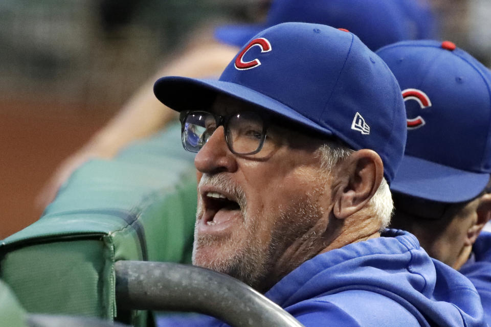 Chicago Cubs manager Joe Maddon yells from the dugout before the team's baseball game against the Pittsburgh Pirates in Pittsburgh, Tuesday, Sept. 24, 2019. (AP Photo/Gene J. Puskar)