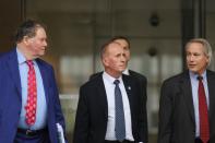 British cave diver Vernon Unsworth emerges from court with attorneys after a U.S. District Court jury found Tesla Inc chief executive Elon Musk not liable for defamation damages, in Los Angeles