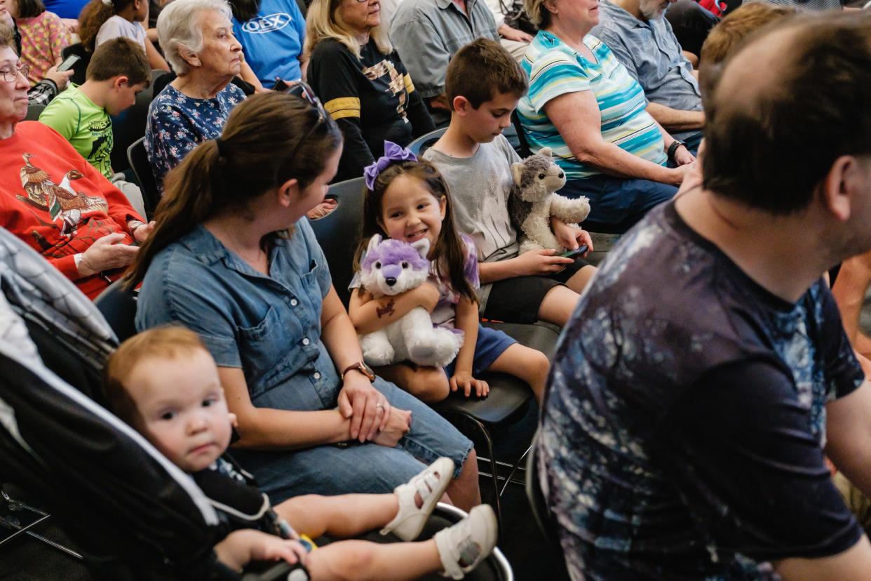 Children hold stuffed animals at the recent educational program on wolves and the role they play in our ecosystem at the Tuscarawas County Public Library System's Main Library in New Philadelphia. The program was led by Rachel Lauren Robertson of The Ohio Canid Center.