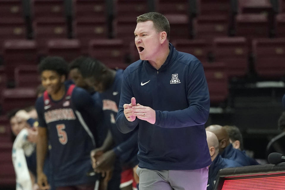 Arizona head coach Tommy Lloyd gestures toward players during the first half of the team's NCAA college basketball game against Stanford in Stanford, Calif., Thursday, Jan. 20, 2022. (AP Photo/Jeff Chiu)