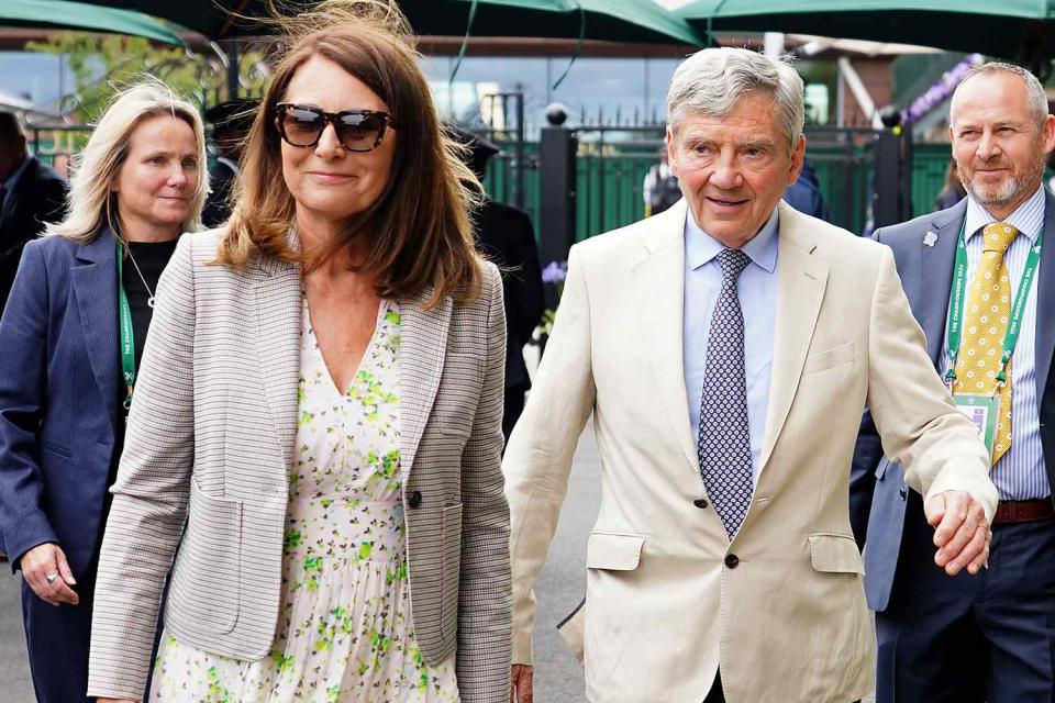 <p>Zac Goodwin/PA Images via Getty</p> Carole Middleton and Michael Middleton arrive at Wimbledon on July 10, 2024.