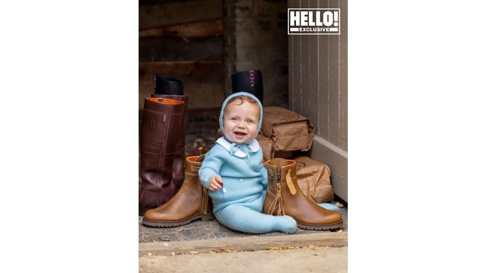 Penelope Chilvers' grandchild posing with boots at Cotswolds home