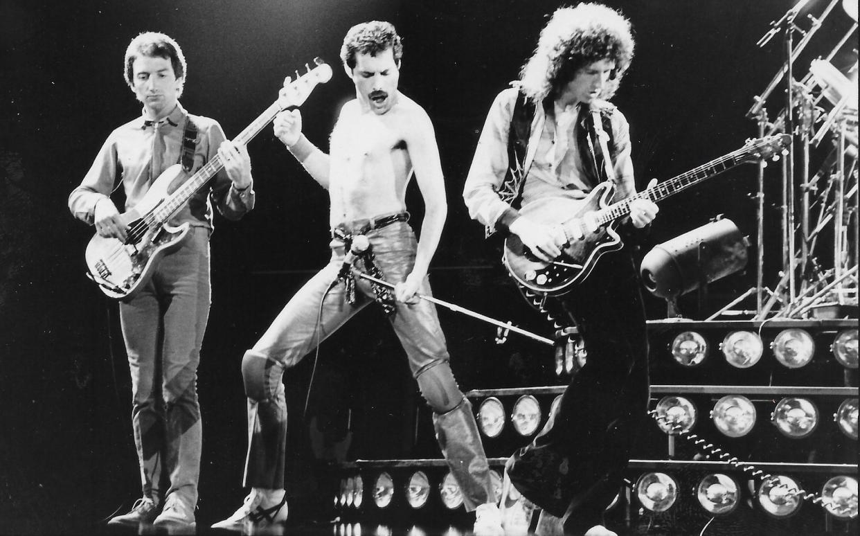 John Deacon, Freddie Mercury and Brian May perform with Queen in 1980.