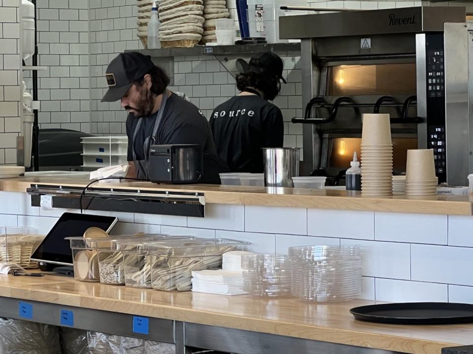 Chef Trevor Routman prepares lunch orders.